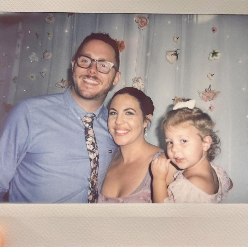 Chris, Sarah, and their daughter — the Ament family